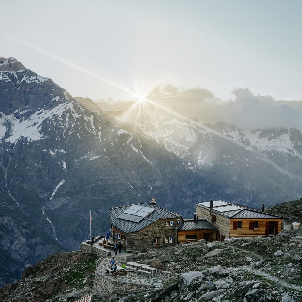 Traditional alpine hut in Zermatt at sunset with panoramic mountain views