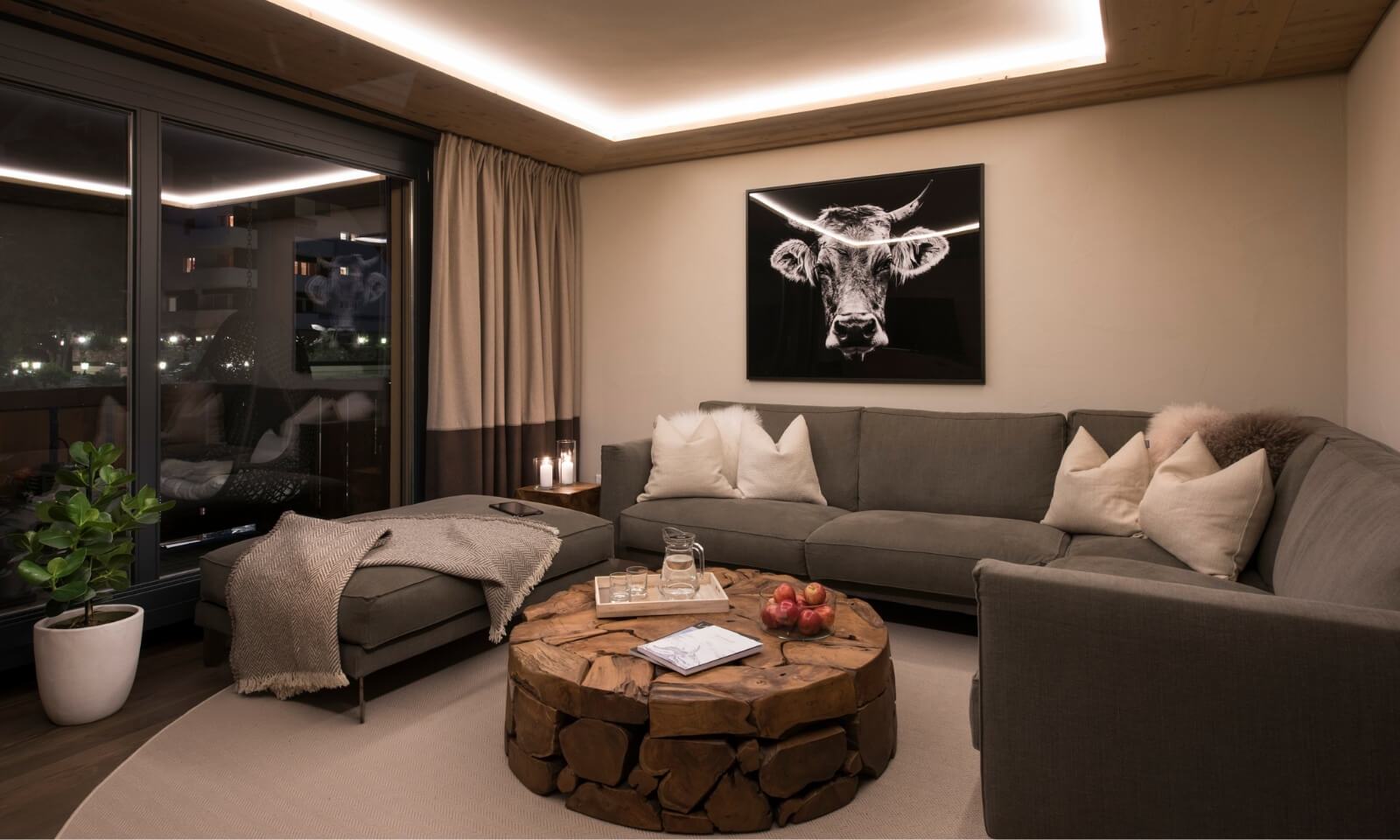 Cozy Zermatt apartment living room with warm evening lighting and alpine design